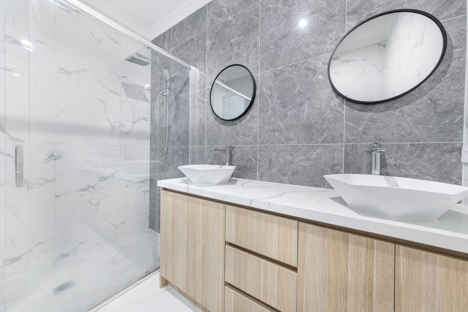 Remodeled bathroom with double vessel sinks